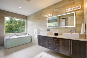 A modern bathroom with a tub and a spacious counter.