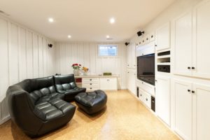 A finished basement with a home theater